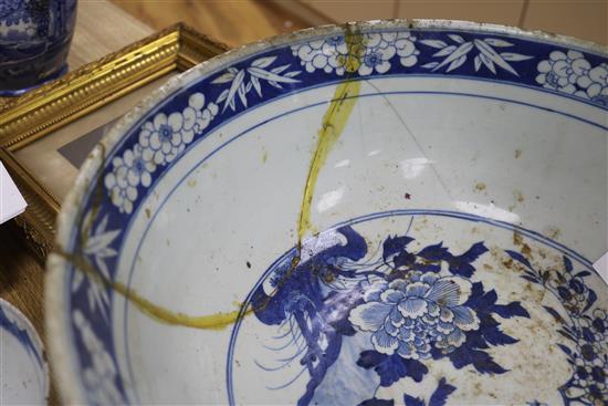 A 19th century Chinese blue and white punch bowl, Diameter 35cm. and three other bowls (a.f.)